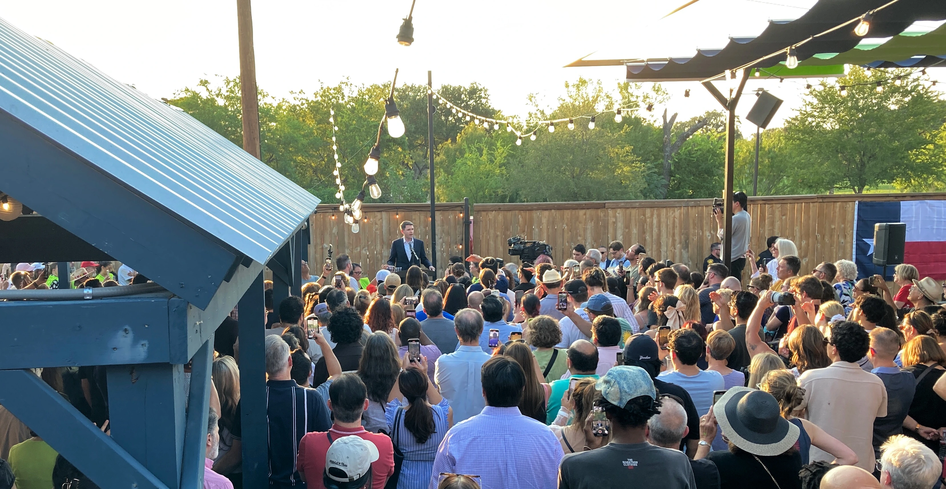 James Talarico speaks to a packed crowd at a Texas campaign rally, energizing his grassroots base with a message of faith, accountability, and working-class values. Photo: Wikimedia Commons / CC BY-SA 4.0 james talarico texas rally crowd public appearance grassroots campaign speech