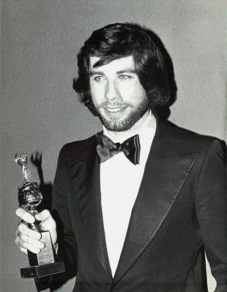 John Travolta receiving the Golden Globe Award for World Film Favorite in 1979