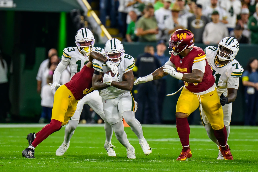 Josh Jacobs in action at Lambeau Field against the Washington Commanders in Week 2 of the 2025 NFL season