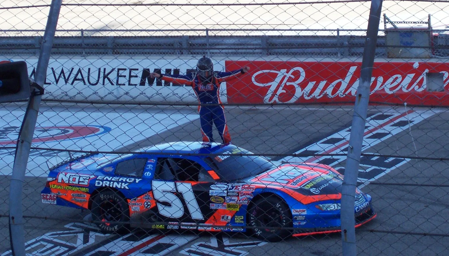 Kyle Busch racing at the Milwaukee Mile during his early career days — one of the many short-track victories that defined his rise