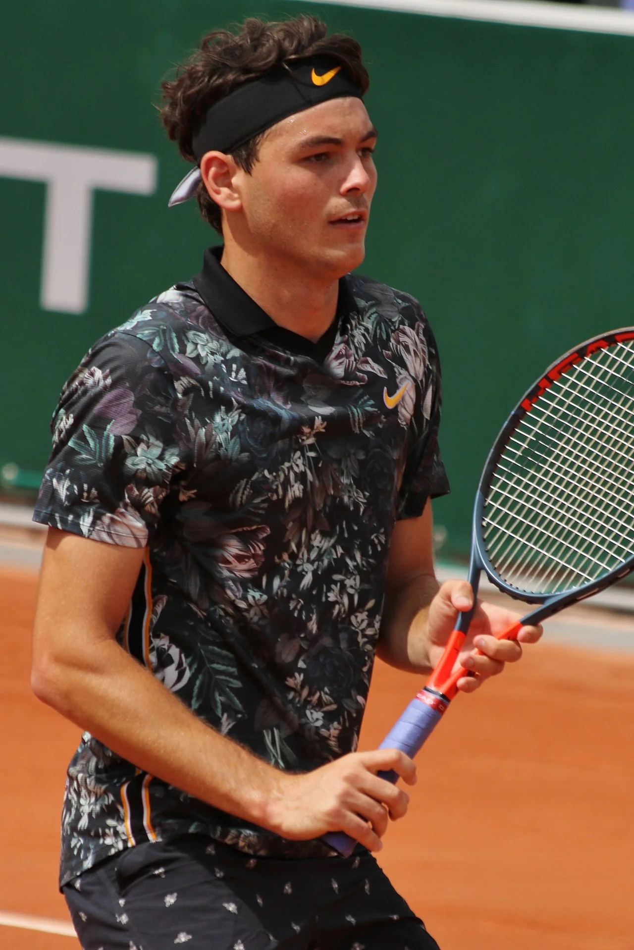 Taylor Fritz at Roland Garros 2019, showing his refined clay-court technique